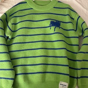 Green sweater with heart